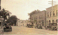 A photo of the village of Webster depicting Main Street.