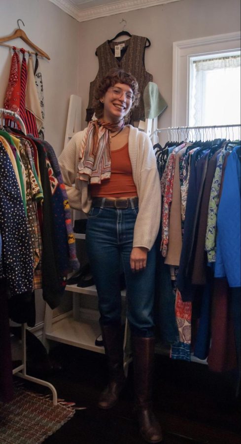 A photo of Op Shops owner, Joanna, among the racks in the store.